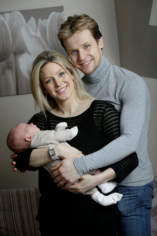 Mark and Kathy Hanretty at home with their new baby. Doug Marke/PAGE ONE